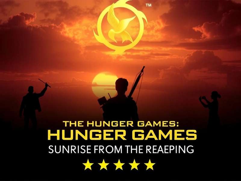Official teaser trailer key art for The Hunger Games: Sunrise On The Reaping showing a golden sunrise over a dystopian city